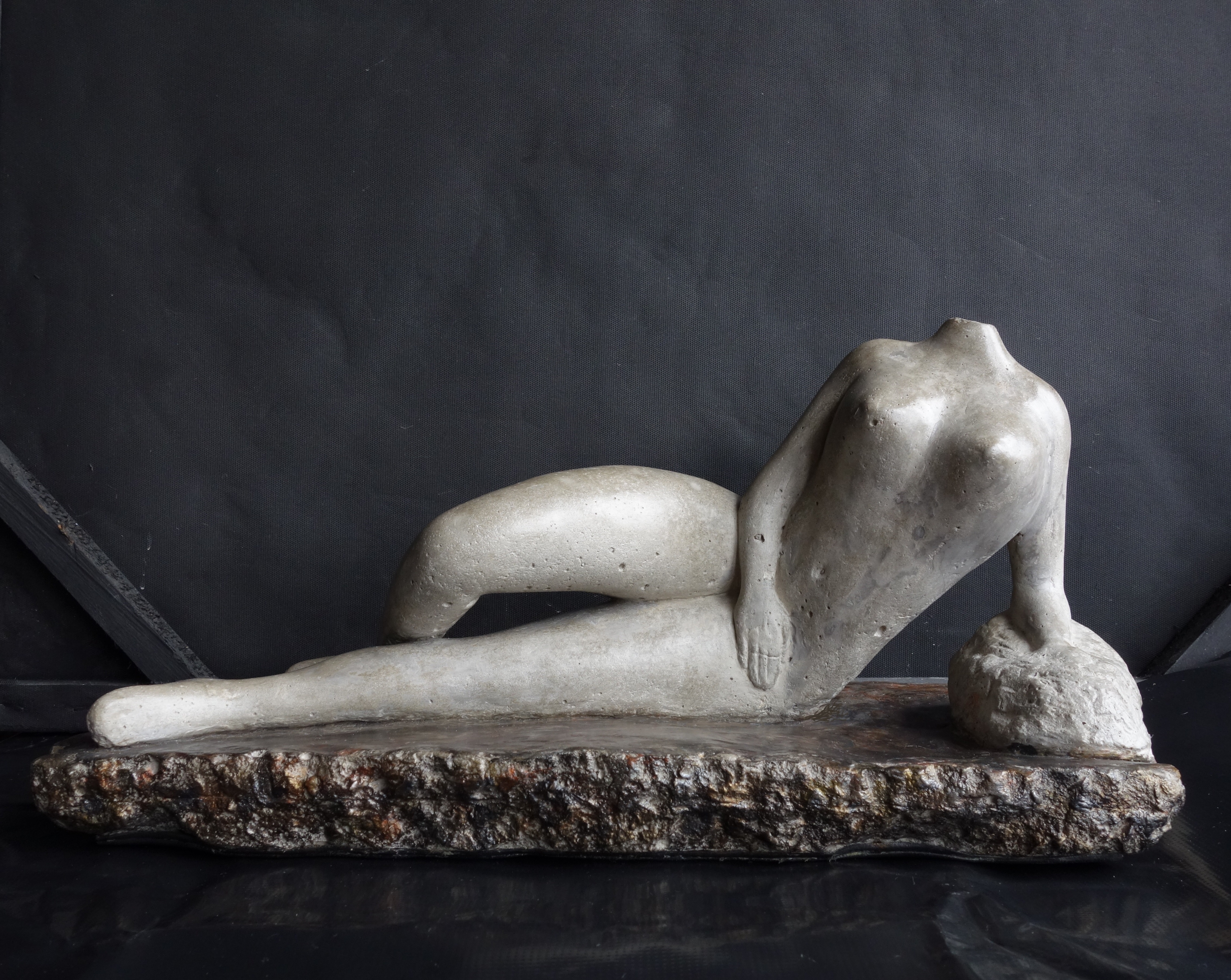 Daniel Gomez; Reclined Woman 2, 2023, Original Sculpture Other, 39 x 20 cm. Artwork description: 241 Sculpture made of concrete and metal.  Base made of concrete.  Title Reclined Woman 2 - Dimensions Height 19cm, Width 20cm, Depth 39cm 7. 00 kgThe beauty of the woman body inspired me for the creation of this artwork.  Year 2023...