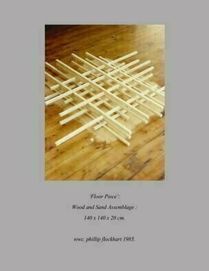 Phillip Flockhart; Floor Piece , 1985, Original Installation Indoor, 55 x 55 inches. Artwork description: 241 An assembled wood and sand construction influenced by Tatlin and using curiosity to engage the viewer to participate by numerical sequence thus physically moving the viewer around the piece and so the viewer alters the spatial relationships of the piece and so becomes the Artist . . .  Lost Signed  ...