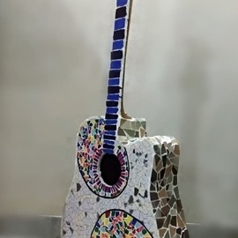 Radha  Chaudhary: 'guitar', 2019 Mosaic, Music. Artist Description: It s a mosaic.  I used my old wooden guitar which was not in use. . . . .  I m a music lover soo i choose to make mosaic of my old guitar.  I have used tiles to make the same. . . .  this is for all the music and guitar lovers there. . .  ...