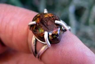 Alberto Thirion: 'silver ring and fire agate', 2021 Jewelry, Beauty. Fire Agate Ring Ring Size: 6. 5 US ATotal Weight: 5. 0 gramsChemical Formula: Silicon dioxide - SiO2Crystal Structure: HexagonalColor: Brown with play of colorHardness: 6. 5 to 7 on the Mohs scaleRefractive Index: 1. 530 to 1. 540Density: 2. 59 to 2. 67...