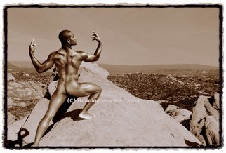 Henning Von Berg: 'HEROIC', 2003 Color Photograph, nudes.  Model Damion climbing a steep cliff in Vasquez Rocks National Park, California. The photograph was published in the coffee table book ALPHA MALES. This image is presented in elegant sepia tone with sloppy borders on quality paper. A special 'panorama version' also is available.  ...