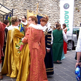 Luise Andersen: 'MEDIEVAL FESTIVAL PREPS  ACQUASPARTA  two', 2006 Color Photograph, Other. Artist Description: . . . . tried to find a shady. . cool spot. . under the trees. . so I could zoom in with my camera. . on all these beautiful costumes. .  the children. . women. . men. . were wearing. . .' Locked in' on their body language. . . . . . . facial expressions. . Dr. Carlo Cerroni was right as usual. . .  this. . would be a ...