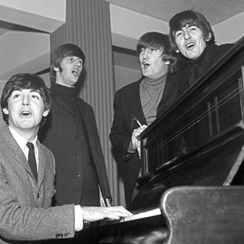 Paul Berriff: 'The Beatles The Chorus', 1963 Black and White Photograph, Music. Artist Description:  The Beatles enjoy a sing song around a piano in their dressing room at the Gaumont Theater in Bradford Yorkshire England before their Christmas concert on 21 December 1963.  This is a limited edition and is signed on the verso by photographer Paul Berriff with limited edition number ...