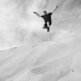 Riley Young: 'wild child', 2022 Digital Photograph, People. Artist Description: Digital photograph of a person jumping in the sand dunes in Death Valley National Park. ...