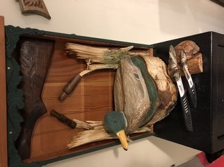 Tony Maez: 'duck in pond', 2019 Wood Sculpture, Animals. This is a beautiful topper for your gun safe it is made the decoy is very detailed and surrounded by hand carved shotgun rifle stock depicting ducks and duck knifes lots of extras to accent this piece. ...