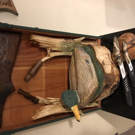 Tony Maez: 'duck in pond', 2019 Wood Sculpture, Animals. Artist Description: This is a beautiful topper for your gun safe it is made the decoy is very detailed and surrounded by hand carved shotgun rifle stock depicting ducks and duck knifes lots of extras to accent this piece. ...