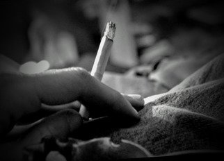 Kenny Mcmahan; Isolation, 2020, Original Photography Black and White, 4 x 6 inches. Artwork description: 241 Photograph of hand holding cigarette  during the Covid- 19 Quarantine . I felt the picture conveyed the emotion of isolation very well. ...