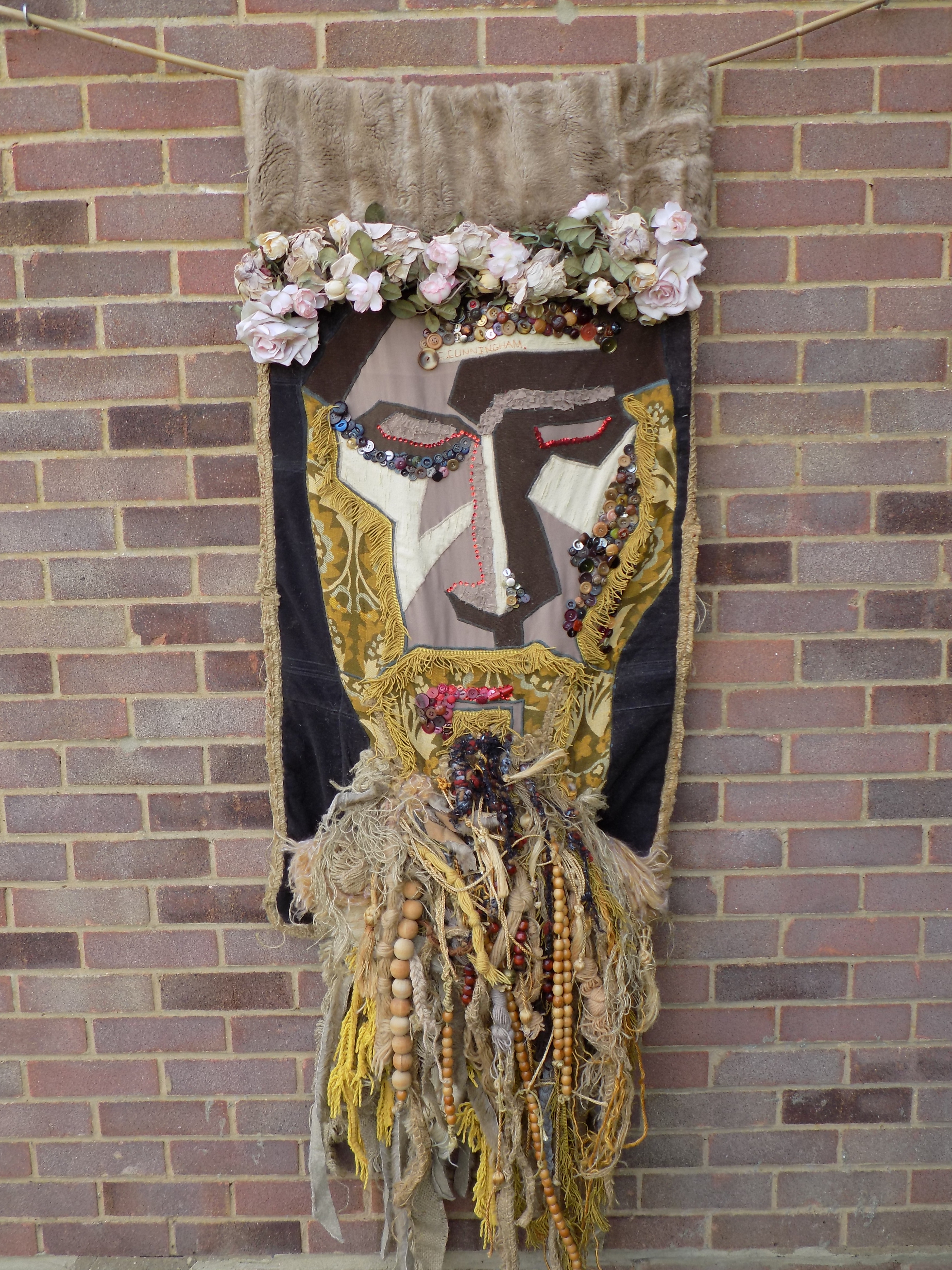 Christine Cunningham; Jesus 1, 2017, Original Textile, 33 x 52 inches. Artwork description: 241 Abstract creation of Jesus.  Applique inspired by Picasso in a sombre colour palette of golds, browns, black and red.  A beard was created with lengths of hessian, wools, beads, fabrics, and pompoms, layered to create volume.  A headdress of recycled silk roses was used to recreate the ...