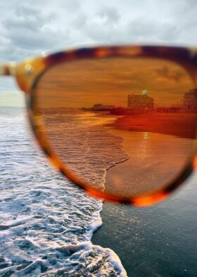 Haile Ratajack; Sunglass Views, 2022, Original Photography Digital, 7 x 10 inches. Artwork description: 241 A shot through the lens of sunglasses depicting a beach house on Misquamicut Beach in Rhode Island...
