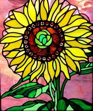 Iva Kalikow; Sunflower, 2021, Original Glass Stained, 19 x 22 inches. Artwork description: 241 Inspired by Georgia Okeeffe, my stained glass art panel consists of 181 hand- cut pieces of 17 different colors and textures of glass.  I used a pale purple translucent glass for the background so the vibrant yellows of the petals would pop.  The panel is framed in ...