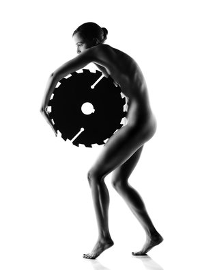 Johan Swanepoel; Nude Woman With Saw Blade 1, 2019, Original Photography Black and White, 21.8 x 29 inches. Artwork description: 241 Figurative silhouette of a nude woman holding a large sharp circular saw blade against her bare skin with white background. Fine art photography of a standing naked female s body with side view...