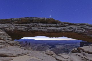 Jon Glaser, 'Stars Over Canyonland', 2015, original Photography Color, 48 x 32  x 1 inches. Artwork description: 1911  After walking and stumbling 1/ 2 miles to Mesa Arch viewpoint, located in Canyonlands National Park in Utah, I was able to capture this moment. Twilight had just begun but the stars in the sky were still visible.This limited- edition photograph, measuring approximately 32