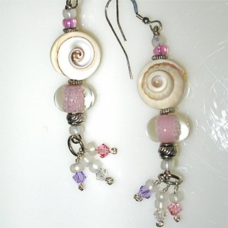 Cheryl Brumfield-Knox; Shells And Pastels With S..., 2010, Original Jewelry, 1 x 2 inches. Artwork description: 241   A natural combination of shells and pastel colors with an interesting clear bead containing tiny bubbles formed on its pink core. These dangle earrings are accented with sparking AB reflective Swarovski crystals, Bali beads, and white matte beads. These matte seed beads were chosen because they resemble ...