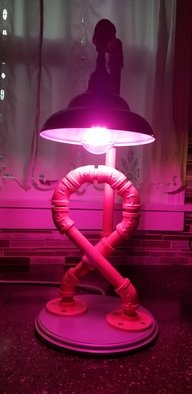 Laura Johnson; Breast Cancer Ribbon Pipe Lamp, 2019, Original Other, 8 x 22 inches. Artwork description: 241 Unique hand crafted black pipe breast cancer ribbon lamp.  This lamp is made of  1 2   pipe and it can be customized with your own color  support all cancer types  cord has  on off switch.  UL Listed 5 foot cord.  Comes with pink led light bulb.  Can ...