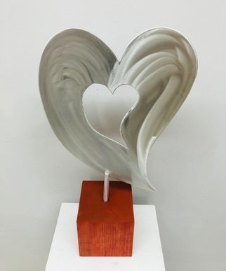 Mac Worthington, 'Love Comes 1st', 2021, original Sculpture Aluminum, 12 x 27  x 5 inches. Artwork description: 1911 Tabletop sculpture.High Polished with a machine brush finish on a Cherry block, 23  x 1  x 5. 5 .Available. Signed   dated. Certificate of Authenticity.Delivery, hanging   shipping availableStudio: 5935 Houseman Rd, historic Ostrander, Ohio.For further information on this piece or to discuss a custom ...