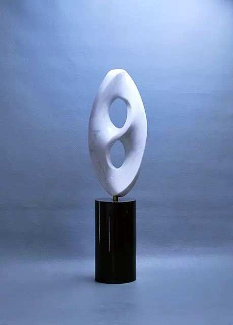 Leslie Dycke; Kensho, 2017, Original Sculpture Marble, 6 x 26 inches. Artwork description: 241 Kenhso is representative of the concept of enlightenment.  Like the human mind it exists in a confined area yet is infinite within.  The sculpture illustrates this by being limited on the outside but within exists a Mobius forma one- sided surface that curves bask upon itself.  Mathematically ...