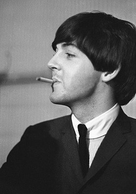 Paul Berriff; Bad Boy Next Door, 1964, Original Photography Black and White, 23 x 33 inches. Artwork description: 241  Paul McCartney with a mischievous look takes time out for a cigarette before The Beatles concert in Leeds England on 22 October 1964.  This is a limited edition and comes signed on the verso by the photographer Paul Berriff with limited edition number and authenticity certificate.  The ...
