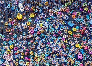 Raf Willems; Floating People, 2020, Original Photography Color, 50 x 36 inches. Artwork description: 241 Aerial shot of people in innertubes and floats, while they are attending a concert on a lake.  Shot with a drone.  High End Acrylic Print with aluminium floating frame.  Limited Edition of 100...