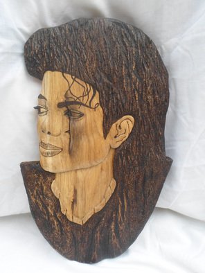 Stefan Irofte; Sculpture Wood Michael Jackson, 2014, Original Sculpture Wood, 27 x 42 cm. Artwork description: 241  A unique and original art work done by hand in wood with distinction. This is a Michael Jackson portret made in oak wood. Initially the wood was in the form of a thick plank and it has been cut in three equal parts and then join together. ...