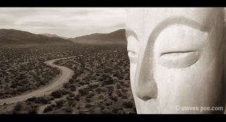 Steven Poe; Sands Of Time, 2002, Original Photography Other, 12 x 7 inches. Artwork description: 241 Buddha face carved in rocky cliff overlooks a desert valley, with a road leading into the distance....