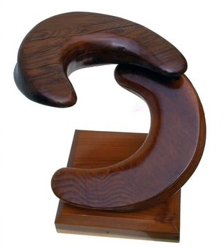 Daryl Stokes; Roundabout, 2011, Original Sculpture Wood, 17 x 18 inches. Artwork description: 241  Contemporary redwood sculpture with a bold spiraling design consisting of two crescent forms joined at the ends to create a raised corkscrew configuration. The simplistic crescent wood forms are heavily curved with gradually tapered ends and distinct soft grooves on the outer edges which accentuate the design. ...