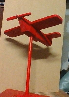 Themis Koutras; Red Plain, 2019, Original Woodworking, 260 x 460 mm. Artwork description: 241 This is a plain made out of wood on a stand it is a ornament or and model...