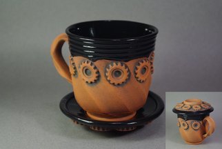 Andrew Tarrant; Tea Cup And Saucer Lid Co..., 2009, Original Ceramics Wheel, 5 x 6 inches. Artwork description: 241  Hand thrown faceted tea- cup sprigged with gear shapes taken from actual machinery. The saucer also fits perfectly as a lid.  ...