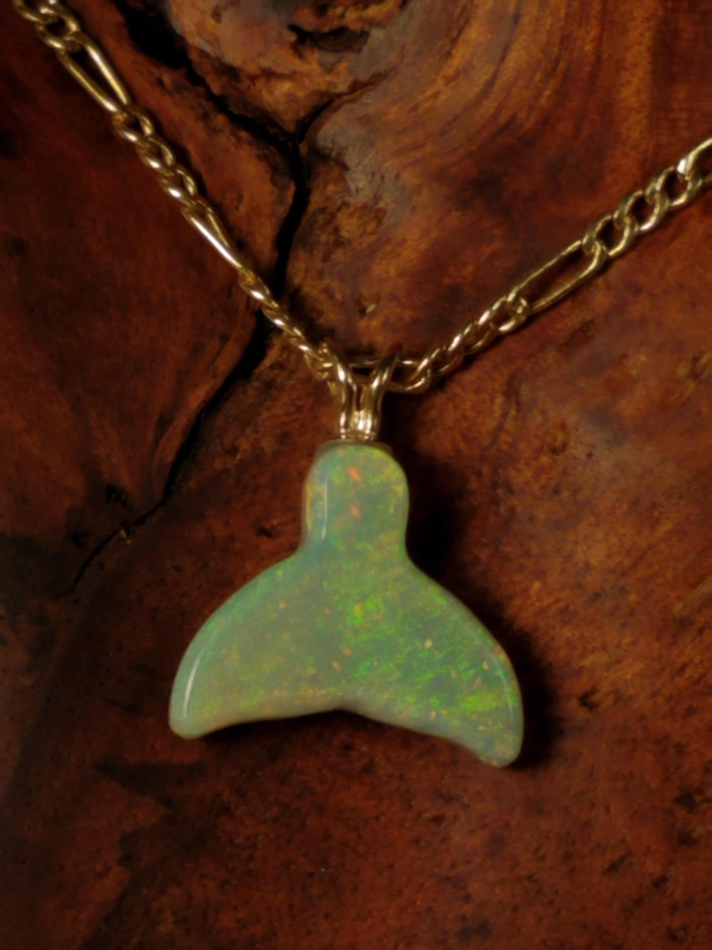 Depasquale Sculptures;  God Created Great Whales, 2018, Original Jewelry, 15 x 17 mm. Artwork description: 241 Australian Crystal Opal Whale Tail pendant.  Crystal, means you can see thru itsomewhat transparent.  Entitled And God Created Great Whales. .  Genesis 122.  Coloring is predominately, fluorescent Green luminescence, with yellow and orange, depending on the angle being viewed and amount of light upon the pendant . .  Indicative of ...