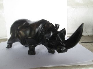 Dimitri Sonkeng; Rhinoceros Made With Ebon..., 2015, Original Sculpture Wood, 9 x 26 mm. Artwork description: 241  Rhinoceros carved with ebony wood  ...