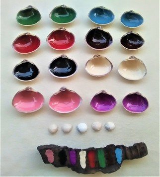Anastasia Pourliotou: 'Game of 16 handpainted seashells', 2020 Crafts, . Memory game of 16, hand- painted, seashells, Mactra Stultorum and Parvicardium Scriptum016A wonderful memory game for kids and adults.The complexity of the 8 colors creates a difficulty level 21- 5in the game.  It also includes 5 small Seashells.  Players count their wins with them and they have at the ...