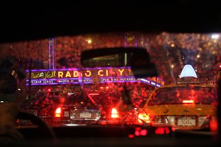 Barry Greff: 'cab ride in the rain nyc', 2009 Color Photograph, Cityscape. For the viewer to feel the experience of being in the back seat of a New York City Taxi Cab during rush hour with a light rain passing Radio City Music Hall. ...