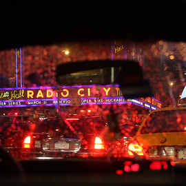 Barry Greff: 'cab ride in the rain nyc', 2009 Color Photograph, Cityscape. Artist Description: For the viewer to feel the experience of being in the back seat of a New York City Taxi Cab during rush hour with a light rain passing Radio City Music Hall. ...