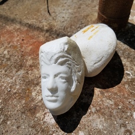 Andrew Wielawski: 'face', 2018 Marble Sculpture, Representational. Artist Description: A tiny head carved from a river stone. The world s best marble scraps were often thrown into the river I took this from, and could easily have been part of a block Michelangelo had cut from the mountains. His quarry was higher up the same river. ...