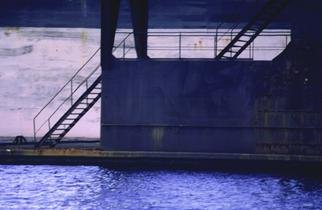 Ellen Spijkstra: '19', 2001 Color Photograph, Marine. The Curacao dry dock at sunset; a dark grey silhouet of two staircases, a purple ship in the background and dark blue water reflections in the front.Laminated with a clear, semi- matt, UV protection layer. ...