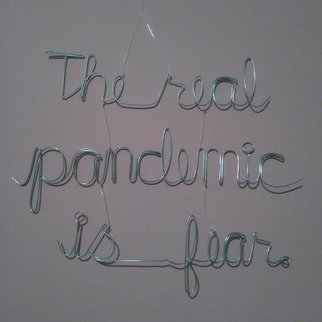 Kelly  Courtney: 'the real pandemic is fear', 2020 Wire Sculpture, Activism. This is the latest in an ongoing street art series called PSA that began in 2004.  Wire words strung together with fishing line looking for a mind to hook. ...