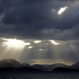 Glen Sweeney: 'rays 6', 2019 Color Photograph, Landscape. Artist Description: A shaft of sunlight illuminates the rolling Norwegian landscape of the sea and fjords. Norway, fjords, sea, winter sun. ...