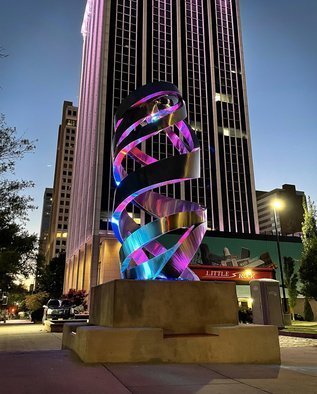 Hunter Brown: 'helios', 2021 Steel Sculpture, Abstract. Helios is a contemporary stainless steel sculpture designed and commissioned for the City of Little Rock. The piece marks the geographic center of Arkansas and sits on the same block with a piece by the renown sculptor, Henry Moore. ...