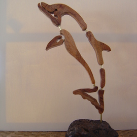 Joel P Heinz Sr.: 'Petroglyph Dolphin', 2007 Wood Sculpture, Culture. Artist Description:  Petroglyph Dolphin is the artests rendering of what a petroglyph of a dolphin might be if it one existed. To date none have been found. The Dolphin is carved from pretious Hawaiian Koa wood. The baise is constructed of hawaiian Koa and lava, There petroglyphs carved into the ...