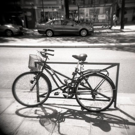 Karen Morecroft: 'A Bicycle in Paris', 2009 Black and White Photograph, Urban. Artist Description:  A bicycle on the city streets of Paris, France. Photo mounted on black card ( approx 6x8) ...