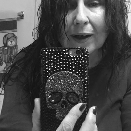 Luise Andersen: 'play with latest present I', 2015 Black and White Photograph, People. Artist Description:  ' bit exhausted. . shower did not help as expected/ hoped. . smiling. . forget' tired eyes' . . see still enough,  to' play  . . bought a protective cover, made by a creative person on Etsy. com . . i like skulls. . and this one is in thin metal bronze tone, and has ...