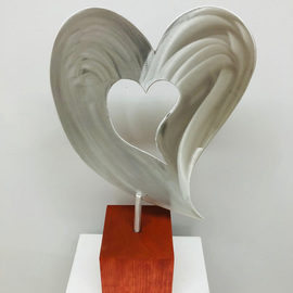 Mac Worthington: 'love comes 1st', 2021 Aluminum Sculpture, Figurative. Artist Description: Tabletop sculpture.High Polished with a machine brush finish on a Cherry block, 23  x 1  x 5. 5 .Available. Signed   dated. Certificate of Authenticity.Delivery, hanging   shipping availableStudio: 5935 Houseman Rd, historic Ostrander, Ohio.For further information on this piece or to discuss a custom design ...