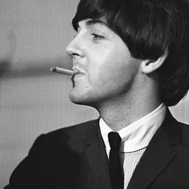 Paul Berriff: 'Bad Boy Next Door', 1964 Black and White Photograph, Music. Artist Description:  Paul McCartney with a mischievous look takes time out for a cigarette before The Beatles concert in Leeds England on 22 October 1964.  This is a limited edition and comes signed on the verso by the photographer Paul Berriff with limited edition number and authenticity certificate.  The image ...