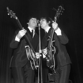 Paul Berriff: 'Reflections', 1963 Black and White Photograph, Music. Artist Description:  Paul McCaartney and George Harrison Share the microphone on stage at the ABC Theater Huddersfield England on 29 November 1963 during The Beatles first UK tour.  This is a limited edition and comes signed on the verso by the photographer Paul Berriff with limited edition number and authenticity ...
