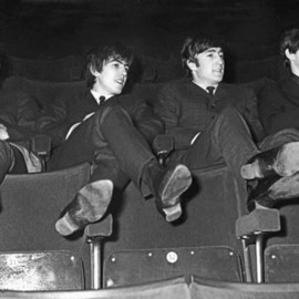 Paul Berriff: 'The Beatles Kicking Back', 1963 Black and White Photograph, Music. Artist Description:  The Beatles relax in the auditorium at the ABC Theater in Huddersfield Yorkshire on 29 November 1963.  This was The Beatles first tour of the UK.  Limited Edition and comes signed on the verso by photographer Paul Berriff with limited edition number and authenticity certificate.  The photograph is ...