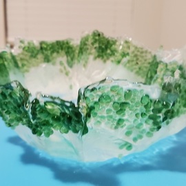 green and white bowl By Rayana Dissel