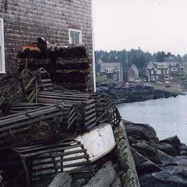 Ruth Zachary: 'Old Traps', 1990 Color Photograph, Seascape. Artist Description: Classic Maine, USA! Old wooden lobster traps ( you hardly see these any more) against weathered gray shingling.  Quaint fish houses and sheltered sea.  Rich in texture, subtle color, spirit and feeling of Maine. Monhegan Island. Limited edition, signed and numbered. 11 x 14 image in a 16 x ...