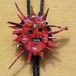 red sun bolo or pin ornament By Richard Lazzara