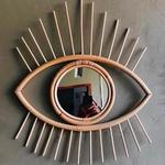 one eye natural rattan mirror By Suku  Bali