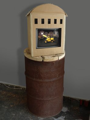 Wayne Montecalvo: 'TRUCKS installation', 2008 Indoor Installation, Landscape.  Animated video of Trucks including burn barrel television set cardboard garage dvd player and a copy of the video titled TRUCKS. ...