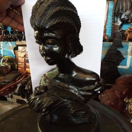 ebony woman statue of woman By Dimitri Sonkeng